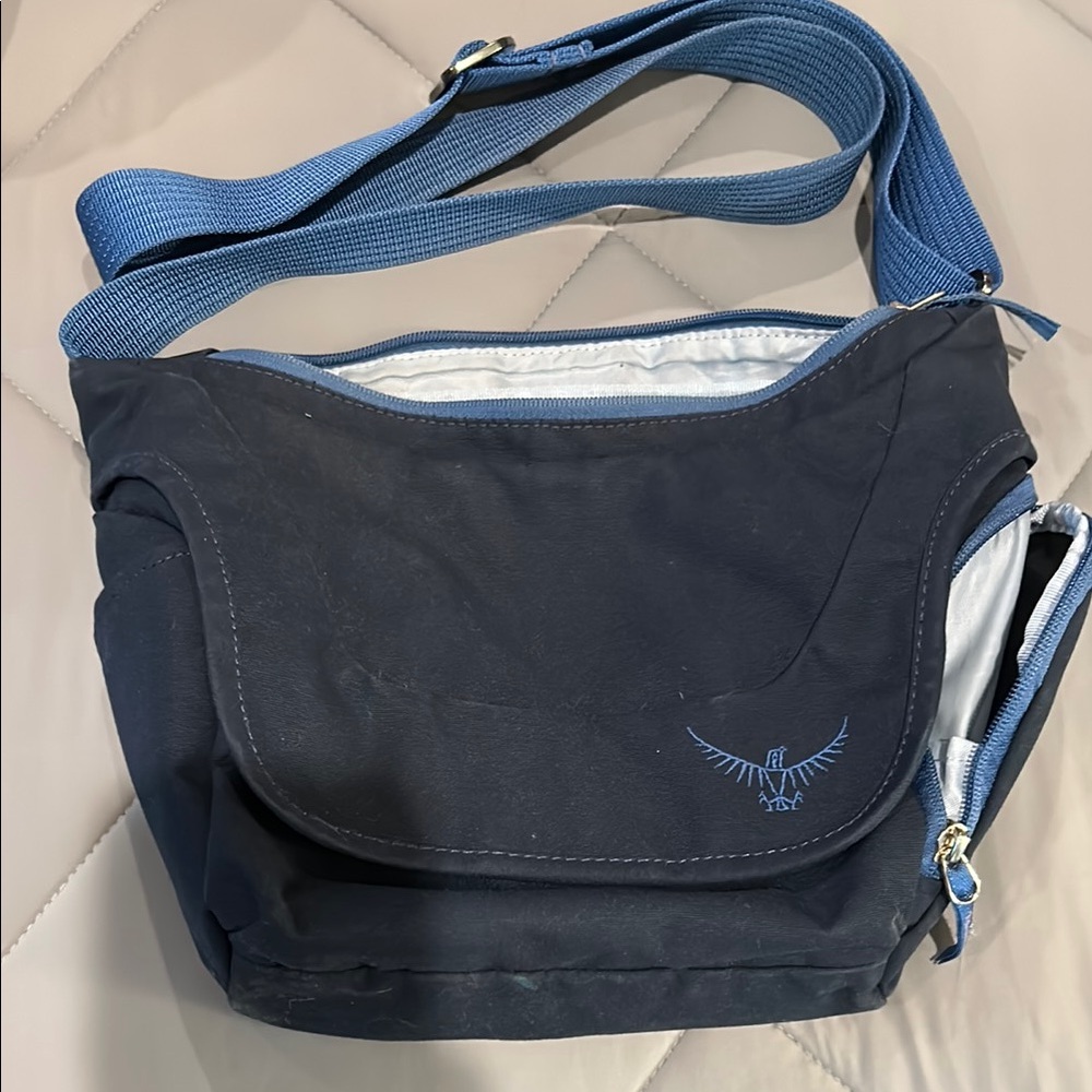 OSPREY Blue and Black Crossbody Bag with Flap Closure
